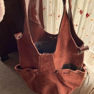 Rust color suede gently used shoulder bag 24 in top/bottom 12 across the bottom